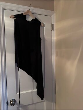 BCBGMaxAzria Black Sleeveless Asymmetrical Top. Flattering waist tie/belt.